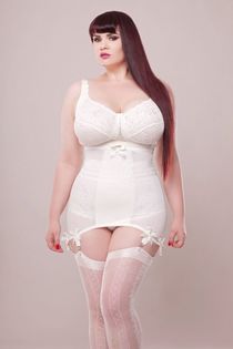 Busty Asian girl oils up
